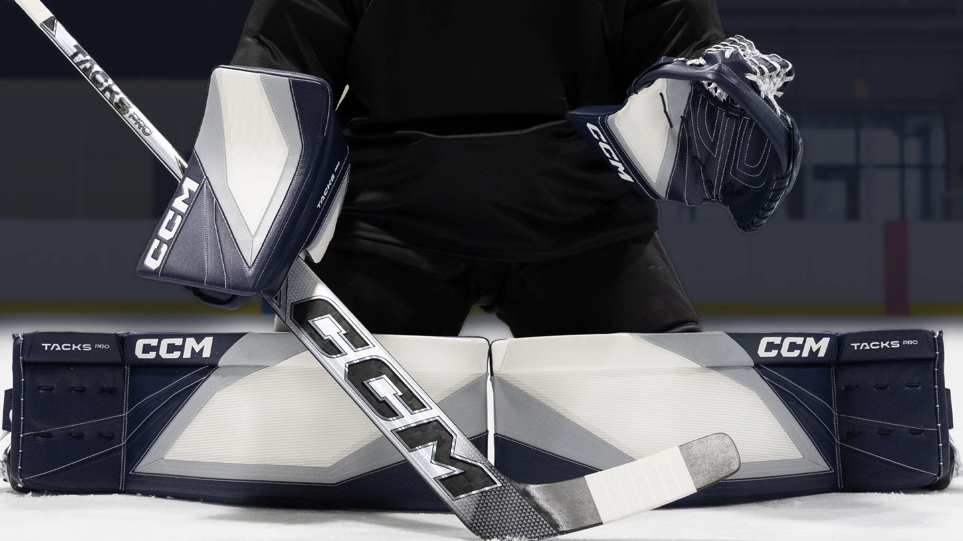 Goalie in butterfly wearing CCM Tacks pads and gloves