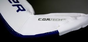Bauer 2S goalie blocker closeup showing C.O.R.TECH logo in white and navy colorway