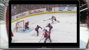 Carey Price in red Canadiens gear defends his crease during a scramble in front of the net with multiple players battling ...