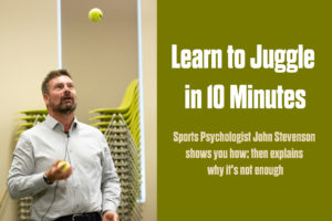 Sports psychologist John Stevenson juggling tennis balls during a mental performance demonstration