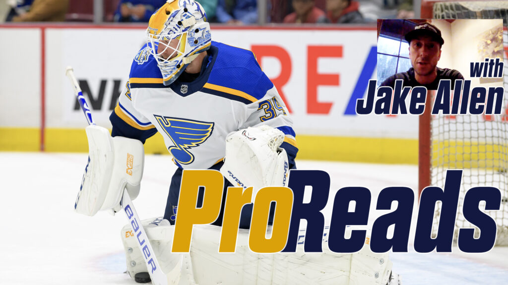 Jake Allen in St. Louis Blues gear in butterfly position making a blocker save during a ProReads feature