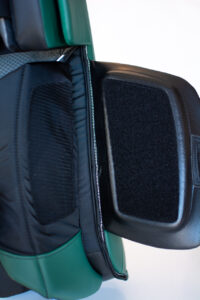 Close-up of CCM AXIS goalie pad calf wrap foam wedge insert showing green exterior and black interior padding