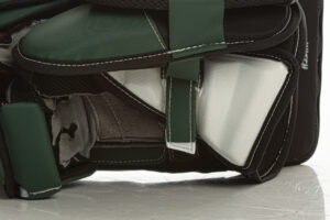 Close-up of CCM AXIS goalie glove interior palm and break, showing green and black colorway construction detail