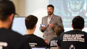 Goalie mental performance coach Stevenson speaks to young goalies at a seminar on parental support and the mental game.