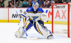 Jordan Binnington St. Louis Blues goalie in butterfly stance tracking play in crease wearing CCM gear at Rogers Arena