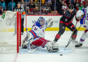 Rangers goalie Igor Shesterkin (31) stretches to make a pad save against the Hurricanes during NHL play-in action.