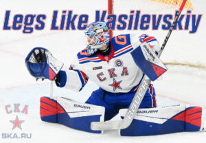 Yaroslav Askarov making a pad save in full butterfly for SKA St. Petersburg, wearing white KHL jersey with red-blue trim
