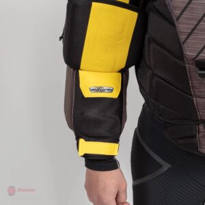 Bauer Ultrasonic goalie chest protector detail showing yellow and black arm padding and blocker-side sleeve protection