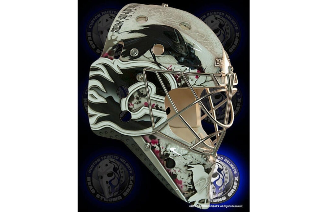 Karri Ramo Halloween-themed goalie mask with dark horror artwork and silver design on black background