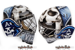 Michaël Vistentin goalie mask featuring skull artwork with blue and white color scheme, shown from front and side angles