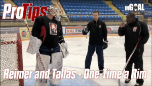 Goalie James Reimer practices one-timer off the rim drill with coach Rob Tallas during on-ice training session