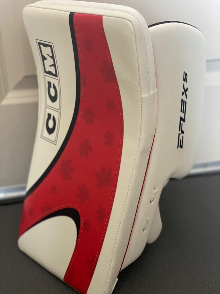 CCM Eflex 6 blocker in white and red Team Canada colorway with maple leaf graphic