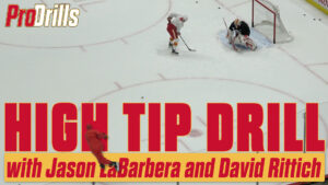David Rittich in Calgary Flames gear tracks a high tip drill during ProDrills training with Jason LaBarbera