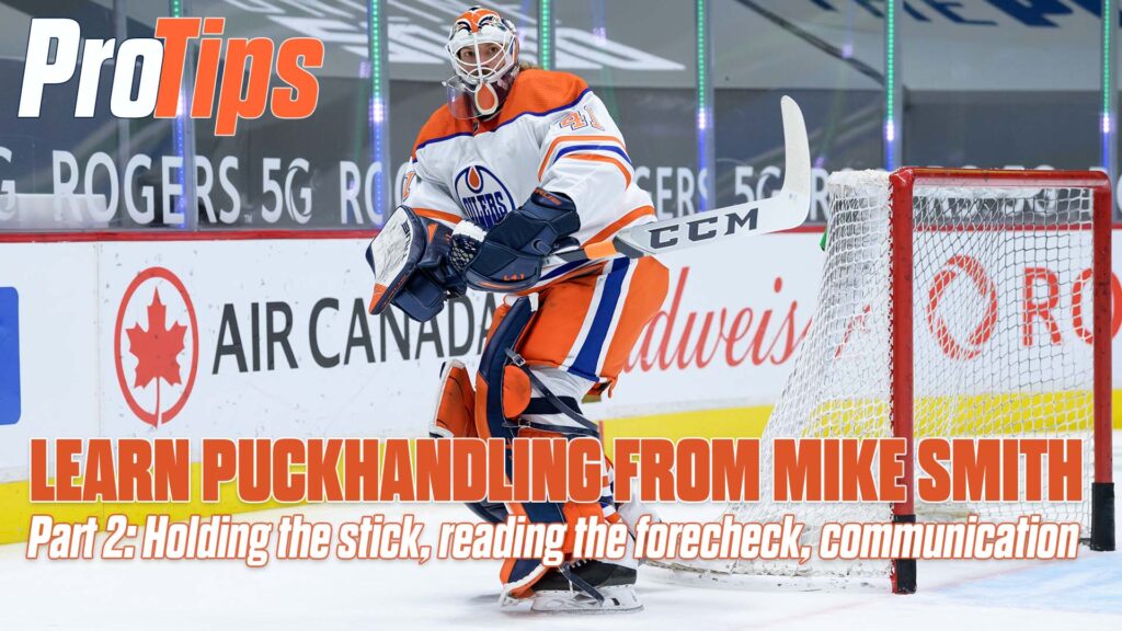 Mike Smith in Edmonton Oilers gear handles puck behind the net, demonstrating stick positioning for puckhandling technique
