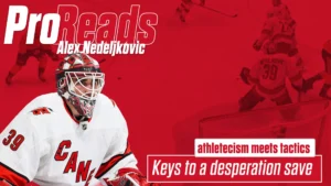 Alex Nedeljkovic in Carolina Hurricanes white jersey making a desperation save, ProReads graphic overlay