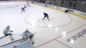 Braden Holtby reads play from crease as puck carrier enters zone, demonstrating proactive positioning and tracking in NHL ...