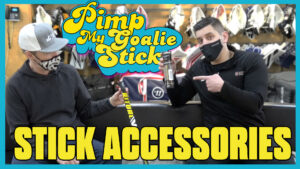 Pimp My Goalie Stick episode thumbnail showing two people examining a goalie stick and accessories in a gear shop.