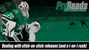 Dallas Stars goalie Braden Holtby in butterfly stance tracking a puck during a 1-on-1 rush in NHL action