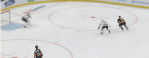 Braden Holtby squares up in his crease as a skater drives in on a 1-on-1 rush during a Capitals game.