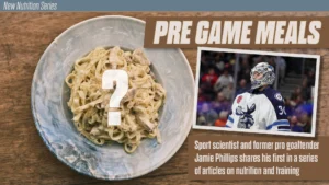 Goalie Jamie Phillips in full gear beside a plate of pasta for a pre-game nutrition article