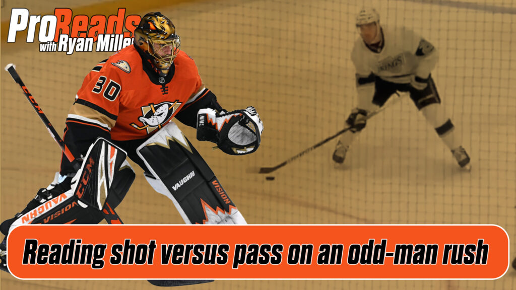 Anaheim Ducks goalie Ryan Miller reads an odd-man rush in full gear, tracking shooter and passer in butterfly-ready stance.