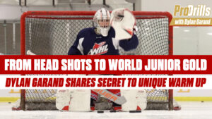 Dylan Garand in full WHL gear making a glove save in butterfly position during warm-up drills
