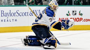 St. Louis Blues goalie Charlie Lindgren makes a butterfly save wearing Bauer KONEKT skates during NHL game action.