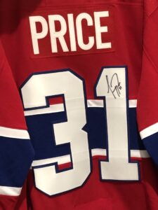 Carey Price autographed Montreal Canadiens #31 red jersey displayed from the back