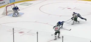 Thatcher Demko in RVH position protecting the post as a shooter drives the rush toward the Canucks net