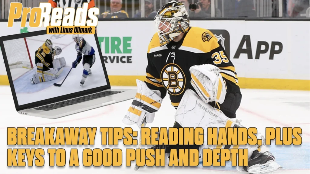 Linus Ullmark Boston Bruins goalie in butterfly stance tracking a breakaway, wearing gold mask and Bruins jersey