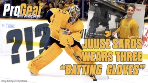 Nashville Predators goalie Juuse Saros in full yellow gear making a save in his crouched butterfly stance