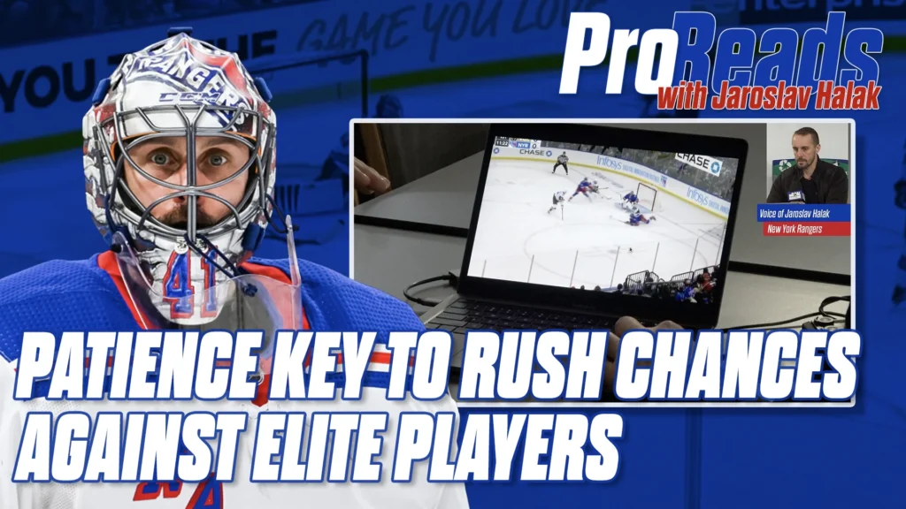Jaroslav Halak in New York Rangers blue mask and gear squares up in his crease during a rush situation analysis