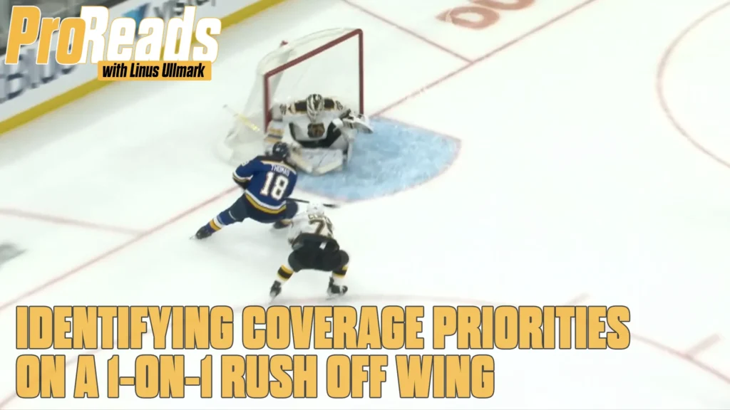 Linus Ullmark in white Bruins gear tracking a 1-on-1 rush off the wing as attacker drives toward the net