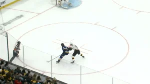 Linus Ullmark tracks attacker on net drive in 1-on-1 situation, positioned at top of crease in Bruins gear
