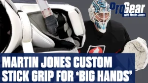 Martin Jones closeup showing custom oversized stick grip on goalie stick, white Vaughn pads visible
