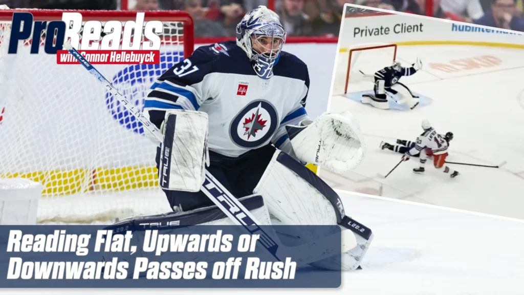 Connor Hellebuyck in Winnipeg Jets gear tracking a 2-on-1 rush, poised in butterfly-ready stance at top of crease