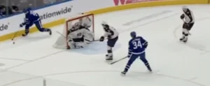 Jet Greaves hugs the post in RVH stance defending a backdoor pass attempt, Toronto Maple Leafs game