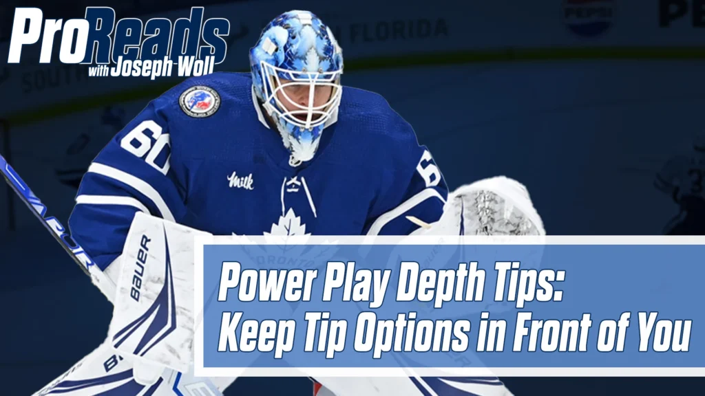 Toronto Maple Leafs goalie Joseph Woll in butterfly stance wearing blue mask and pads during power play situation