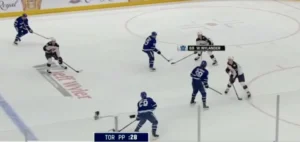 Jet Greaves holds his edges in crease during Toronto power play, tracking play developing at blue line