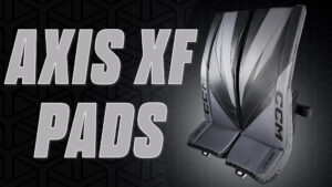CCM Axis XF goalie pads displayed upright showing full pad face, knee stack, and toe bridge in grey and black colorway