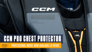 CCM Pro goalie chest protector close-up showing shoulder cap and strapping system with orange accents