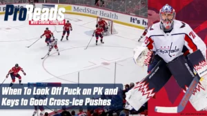 Capitals goalie Charlie Lindgren in stance during a penalty kill, tracking play cross-ice in full Washington Capitals gear.