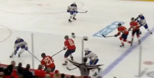 Devon Levi reads an incoming rush, set in his crease as defenders battle in front during a Florida Panthers game.