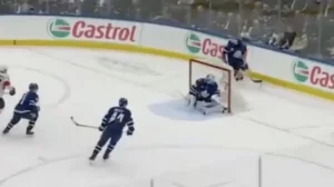 Joseph Woll making a double seal save in crease for the Toronto Maple Leafs, dropping to seal both posts against a scramble