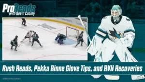 San Jose Sharks goalie Devin Cooley in white pads set in crease as odd-man rush develops in front of him.