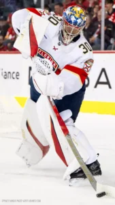 Spencer Knight puckhandling tall