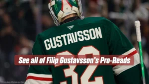 Filip Gustavsson in Minnesota Wild green jersey viewed from behind, positioned at the post during net play