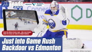 Buffalo Sabres goalie Alex Lyon in butterfly stance defending against Edmonton rush in NHL game