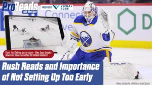 Buffalo Sabres goalie Alex Lyon in butterfly tracking a rush, wearing white Sabres pads and jersey