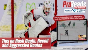 Brandon Bussi makes a save in tight, challenging rush depth and recoil positioning in white pads